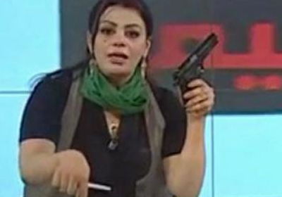 هالة مصراتي أثناء عملها كمذيعة باسم سلطات القذافي